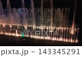 Colorful dancing fountain show at night in Almaty Colorful dancing fountain show at night in Almaty 143345291