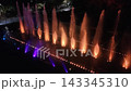 Colorful dancing fountain show at night time Colorful dancing fountain show at night time 143345310