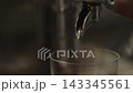 Closeup shot of pulling an espresso shot from coffee machine 143345561