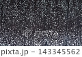 Rain drop hitting window glass and sliding down 143345562