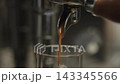 Closeup shot of pulling an espresso shot from coffee machine 143345566