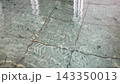 A shimmering, transparent water surface and a stone tiled bottom. 143350013