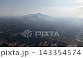 Aerial view of Tangkak rural farmland and misty mountains at sunrise. 143354574