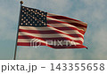An American flag waving in the sky on Independence Day at morning 143355658