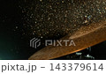 Super Slow Motion Shot of Cymbal Hit With Golden Glittering Particles at 1000fps. 143379614