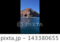 View from a boat speeding past the island 143380655