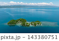 Beautiful deep blue sea with island under blue skies and clouds. Bangkay Island. Mindanao, Philippines. Travel concept. 143380751