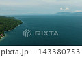 Tropical island and deep blue sea and waves. Samal Island. Davao, Philippines. 143380753