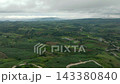Mountain road between a banana plantation and agricultural land. Mindanao, Philippines. 143380840