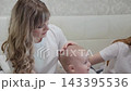 Cheerful happy family on the bed. 143395536