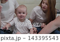 Cheerful happy family on the bed. 143395543
