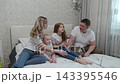 Cheerful happy family on the bed. 143395546