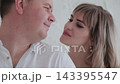 Lovers bask in the light room of the photo studio. 143395547