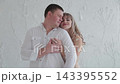 Lovers bask in the light room of the photo studio. 143395552