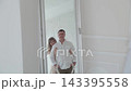 Lovers bask in the light room of the photo studio. 143395558