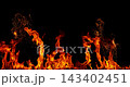 Fire and glowing sparks captured in extreme super slow motion at 1000fps on a cinematic high-speed camera against a pure black background, creating a dramatic VFX overlay. 143402451
