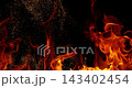 Fire and glowing sparks captured in extreme super slow motion at 1000fps on a cinematic high-speed camera against a pure black background, creating a dramatic VFX overlay. 143402454