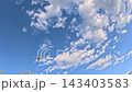Wispy Clouds Drifting Over Sky With Bird Flying Diagonally 143403583