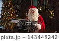 Merry Christmas. Santa mail. Happy Santa typing tact on typewriter for New Year Christmas in festive living room. Santa typing letter on Christmas eve. Mail of Santa Claus. Winter Holiday Celebrations 143448242