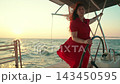 Woman helm of yacht. Yacht sailing on sea, woman captain controls marine vessel. Captain woman helm of ship sailing on ocean. Sea voyage. Captain helm of schooner. Make dream Sail towards adventure 143450595