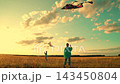 Children play with kite in meadow. Children toy airplane. Child boy dreams flying, child walks in field with kite. Kite in hands of child takes off into sky, park. Kids play, dream traveling in nature 143450804