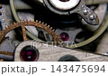 Extreme macro shot of vintage mechanical watch movement with ruby jewel bearings and oscillating balance wheel 143475694