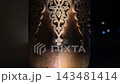Intricate Carved Patterns on Traditional Uzbek Wooden Columns at Night. 143481414