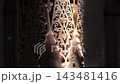 Intricate Carved Patterns on Traditional Uzbek Wooden Columns at Night. 143481416