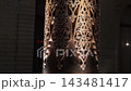 Intricate Carved Patterns on Traditional Uzbek Wooden Columns at Night. 143481417