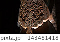Intricate Carved Patterns on Traditional Uzbek Wooden Columns at Night. 143481418