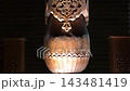Intricate Carved Patterns on Traditional Uzbek Wooden Columns at Night. 143481419