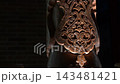 Intricate Carved Patterns on Traditional Uzbek Wooden Columns at Night. 143481421
