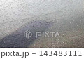 rain drops falling on wet asphalt 143483111