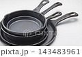 Cast iron skillet set of 4 sizes, professional kitchen cookware. 143483961