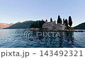 Our Lady of the Rocks church surrounded by mountains in Perast Kotor Bay 143492321