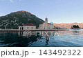 Famous Our Lady of the Rocks artificial island in Kotor Bay Perast 143492322