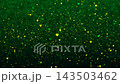 Magical abstract background featuring glowing heart-shaped particles in vibrant yellow, gold, and green floating over a dark backdrop. Ideal for Valentine's Day, romance, wedding, and festive motion 143503462