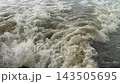 Foamy Water Wake Behind a Moving Motorboat 143505695