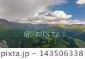 aerial hyperlapse of incoming storm over mountains 143506338
