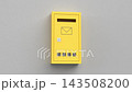 Yellow mailbox on grey wall 143508200