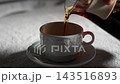 Freshly brewed black coffee poured into a white cup against the light - Live-action 4K 143516893