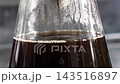 Close-up of black coffee and condensation in a glass carton - Live-action 4K 143516897