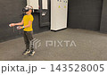A boy in yellow Tshirt immerses himself in virtual reality. Playing virtual reality game with headset. A party children's center. Modern technology, VR games, and digital entertainment for children. 143528005