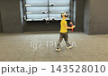 A boy in yellow Tshirt immerses himself in virtual reality. Playing virtual reality game with headset. A party children's center. Modern technology, VR games, and digital entertainment for children. 143528010