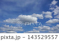 Textured clouds are flying across the blue sky. Timelapse. 143529557