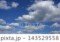 Textured clouds are flying across the blue sky. Timelapse. 143529558