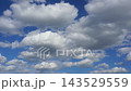 Textured clouds are flying across the blue sky. Timelapse. 143529559