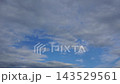 Textured clouds are flying across the blue sky. Timelapse. 143529561