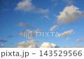 Textured clouds are flying across the blue sky. Timelapse. 143529566