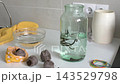 Medicinal leeches are moved from a bag of peat into a jar of water. This process is part of hirudotherapy for healthcare and treatment purposes 143529798